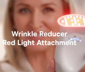 a video thumbnail of a woman holding the TRINITY+ with Red Light Attachment by NuFACE