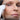 Photo of a woman using a facial lift device.