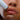 Woman using NuFace lip flick device