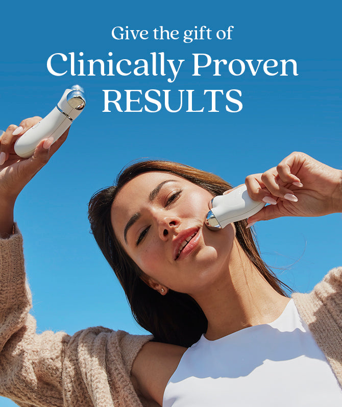 a promotional poster with the text "Give the gift of Clinically Proven RESULTS" above a NuFACE customer holding the MINI+ device in one hand and the TRINITY+ device in the other